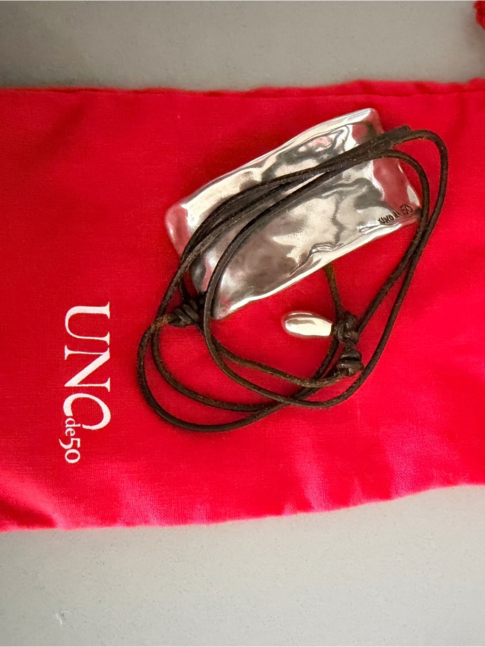UNO de 50 Silver Tone Ring-Style Wearable with Black Cord Accent - Picture 3 of 5